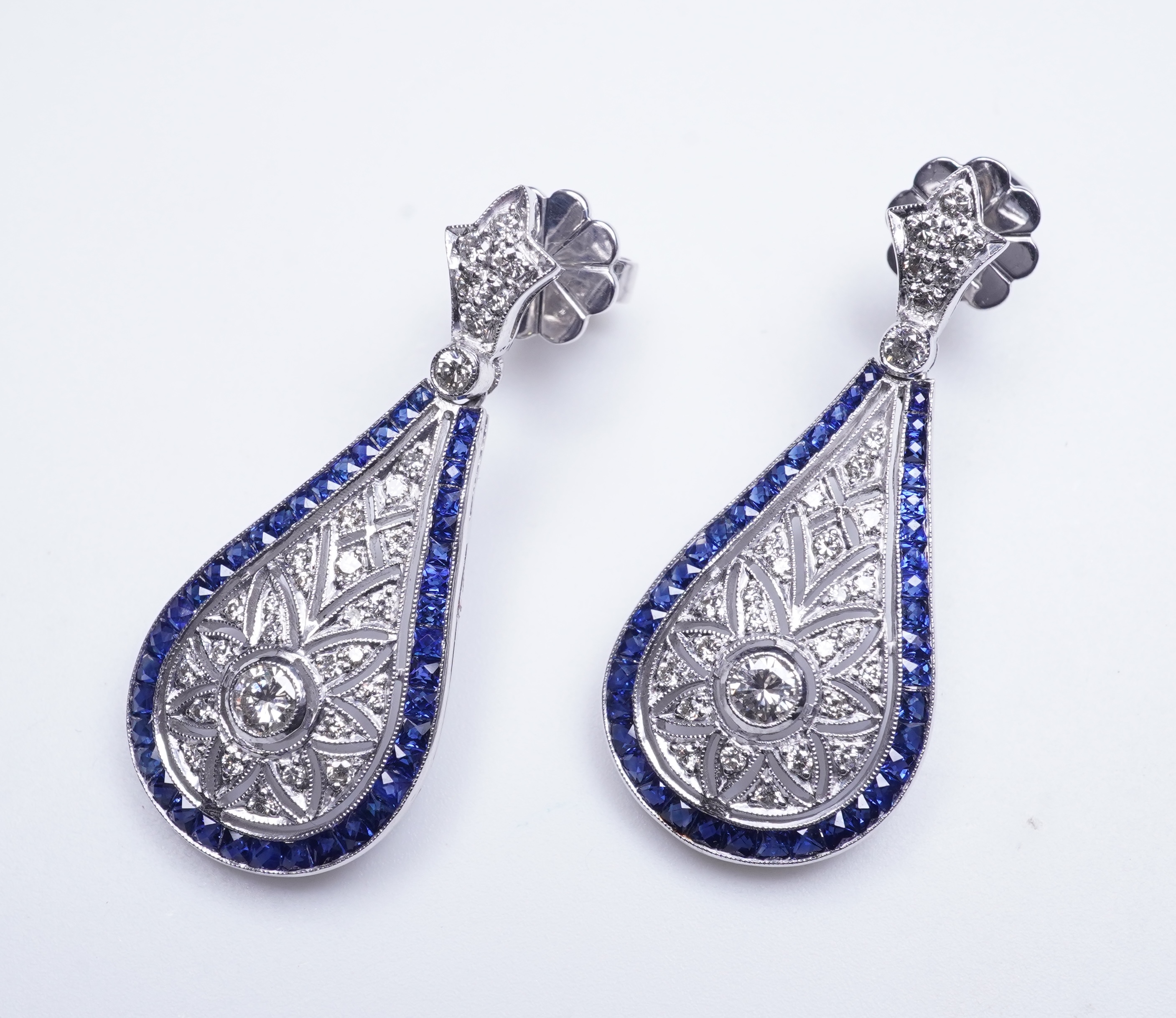 A pair of sapphire and diamond earrings